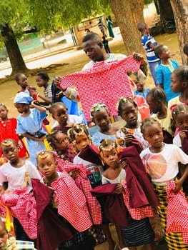 Headteacher with pupils Farafenni Uniforms